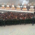 Chinese police encircle local Tibetans marking the Tibetan day of prayer in Kumbum, eastern Tibet.