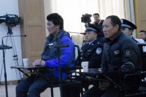 Lobsang Kunchok (right) and his nephew Lobsang Tsering stand trial over inciting self-immolation, on 26 January 2013.