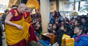 His Holiness the Dalai Lama greeting members of the audience. Photo: Tenzin Choejor/OHHDL