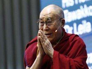 His Holiness the Dalai Lama addresses the panel discussion. Photo: Reuters/Denis Balibouse
