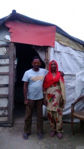 Ramesh and his wife outside their home in Dharamshala